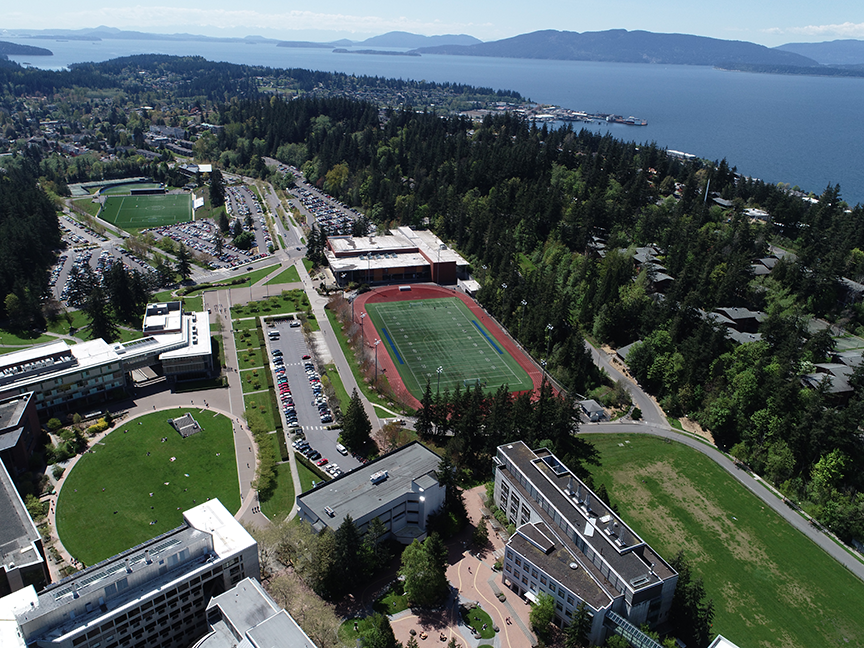aerial view of campus with bay and islands in the background