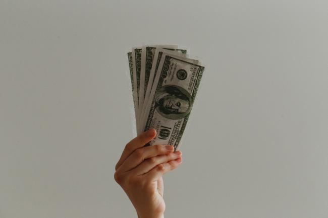 hand holding paper money